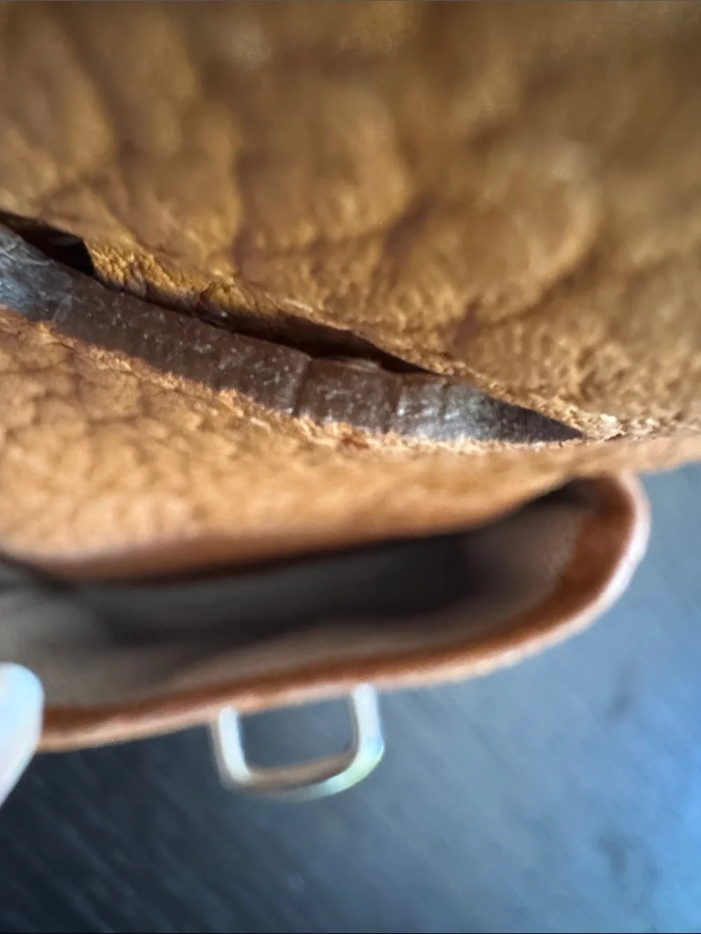 Dooney & Bourke tan pebbled leather side pockets belted satchel bag.